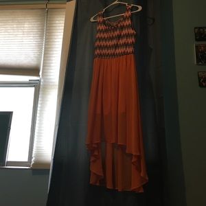 A orange high low dress