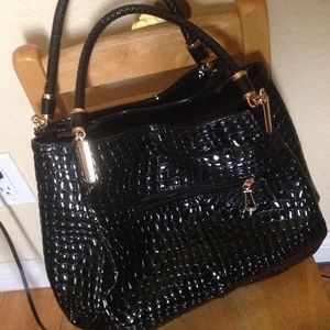 Black shiny hand bag