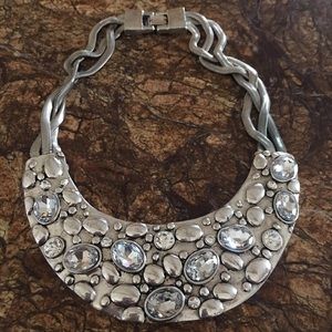 Heavy silver jeweled necklace.