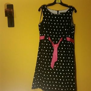 Black and white polka dot dress with pink sash