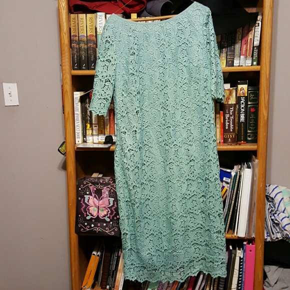 A teal colored lace dress