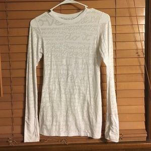 White lululemon long sleeve with wording
