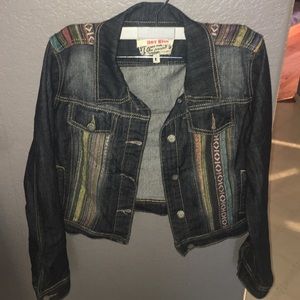 Denim jacket with striped colorful detail