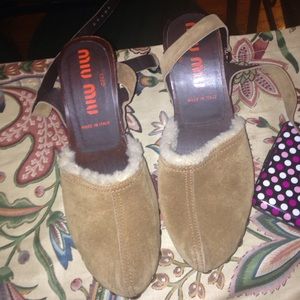 Miu miu fur open back heels.
