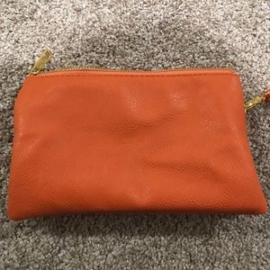 Orange wallet wristlets