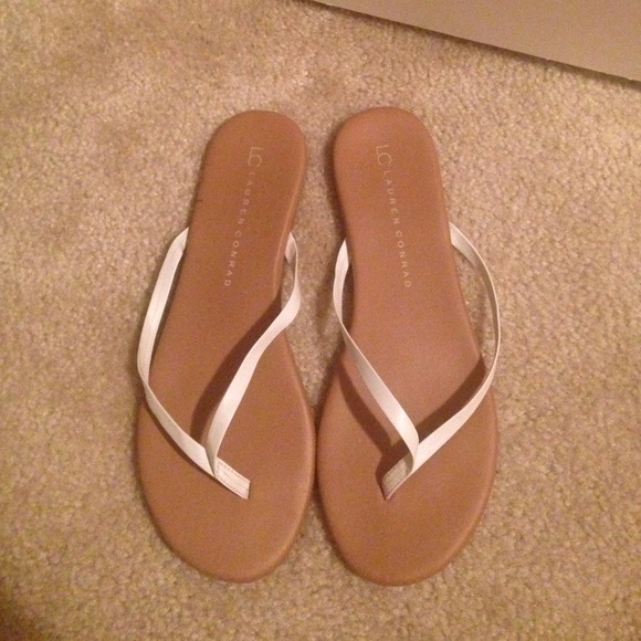 White and Tan Flip Flops