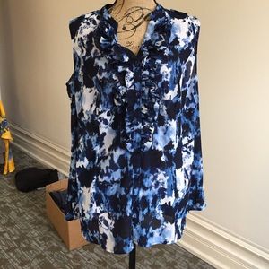 Sleeveless button down top with ruffled accent