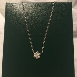 White gold floral diamond pendant. 16" chain