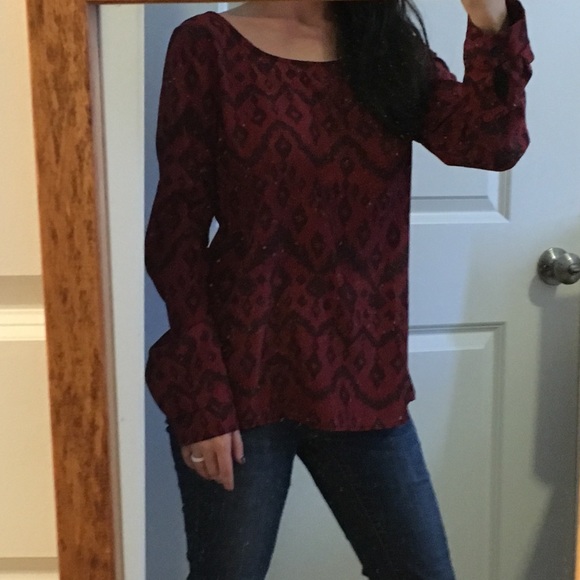 Long sleeve top featuring cross back