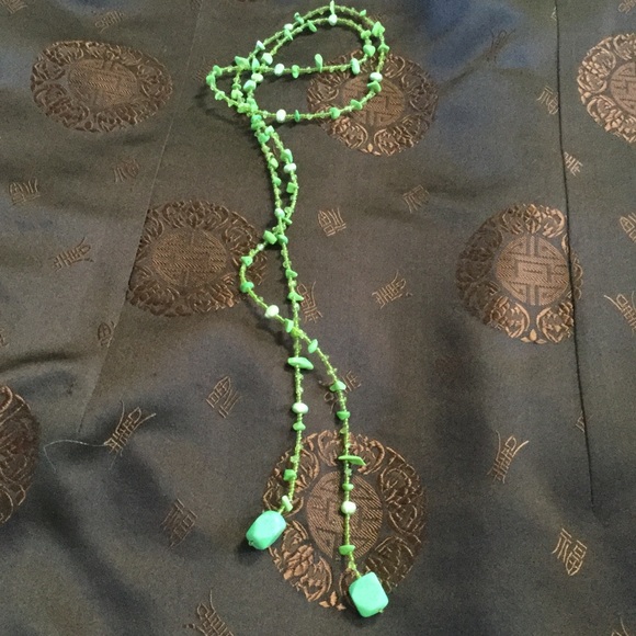 Handmade necklace in green, brown, black and clear