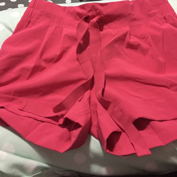 Pink lululemon shorts Brand new ever worn size 4