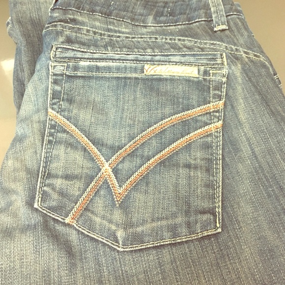 Faded indigo William Rast reg rise trousers.
