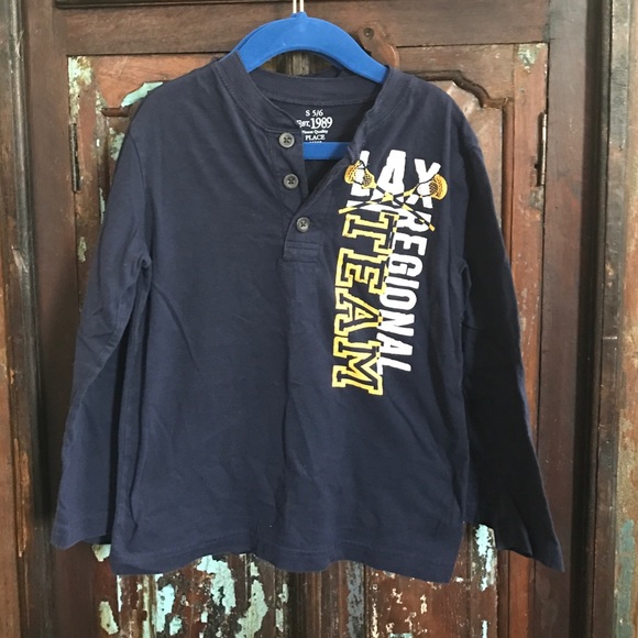 Long sleeve boys dark blue shirt.