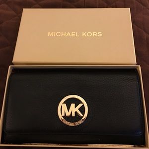 Authentic MK black leather wallet.