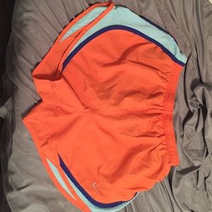 orange and blue nike shorts