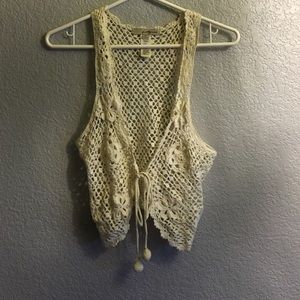Crocheted vest with a tie in the front