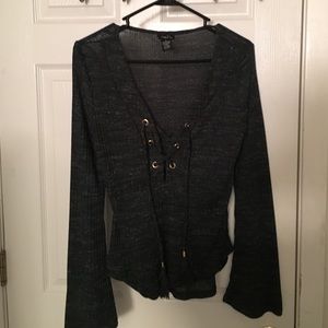 dark green shirt with ties in the front