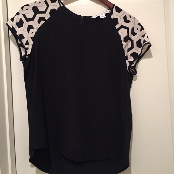 Black, short-sleeve DVF blouse, size S.