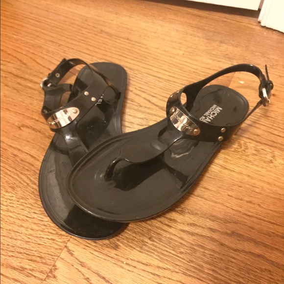 Michael Kors black adjustable sandals.