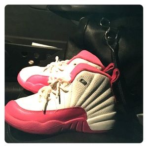 Kids pink and white Jordan 12s