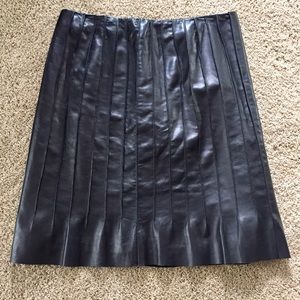 Black leather pleated skirt