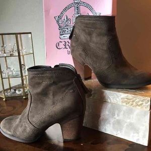 Dark brown sued boots.