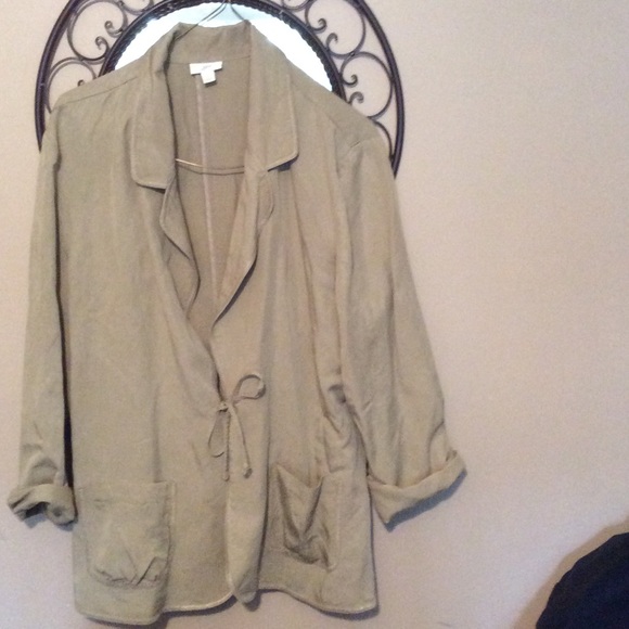 Light tan jacket with bow tie on front pocket