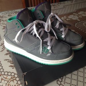 A pair of Girls Kids Jordan 1 Flight shoes