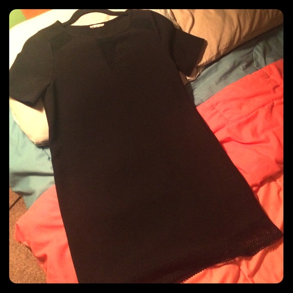 Black dress with mesh neckline and bottom detail