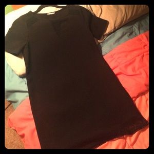 Black dress with mesh neckline and bottom detail