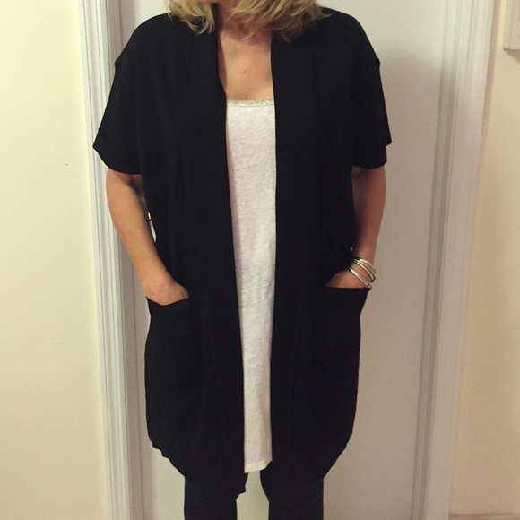 Mistook black, short sleeve, tunic length jacket.