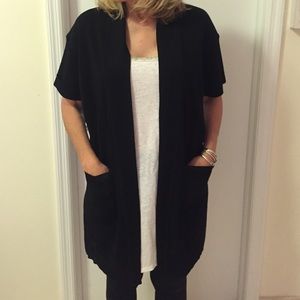 Mistook black, short sleeve, tunic length jacket.