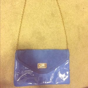 Blue clutch with gold chain strap