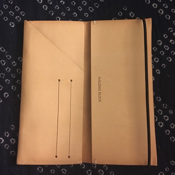 Building block wallet.. tan and black in color