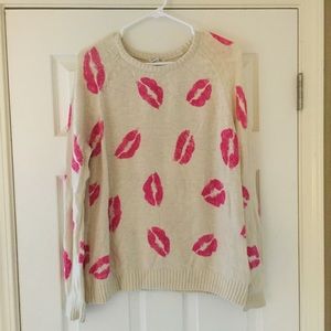 Soft cream sweater with lipstick graphic