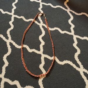 Long gold and orangey red necklace