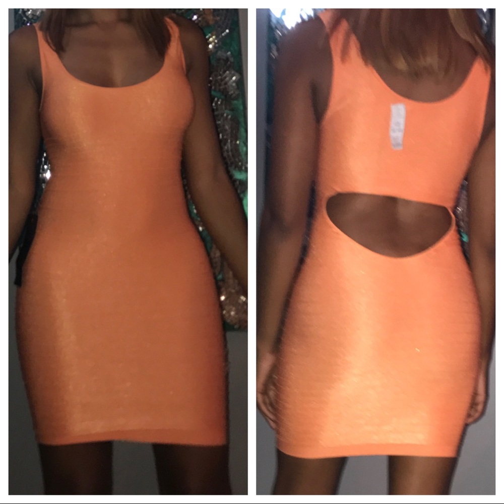Bebe dress brand new size medium, orange color.