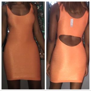 Bebe dress brand new size medium, orange color.