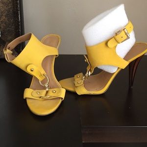 Yellow and gold strap heels.