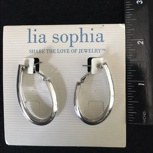 Lia Sophia silver hoops. Oval shaped.