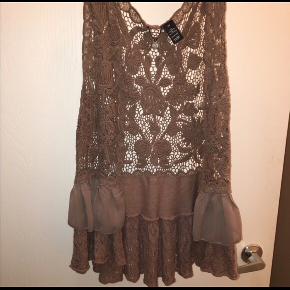 Gorgeous lace over piece from buckle.