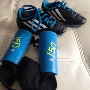 Adidas soccer cleat and shin guard.