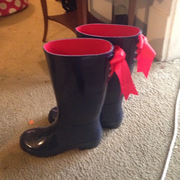 Blue rain boots with red bow