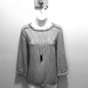 Black and white print blouse.