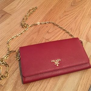 Prada red wallet on a chain. Worn once!