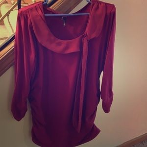 3/4 length sleeve maroon dress shirt with bow.