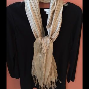Tan scarf with black, silver, grey threads.