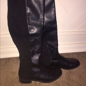 Black knee high boots.