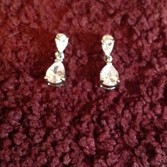 Silver toned dangle diamond earrings
