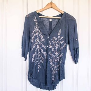 Navy blouse with flower embellishment